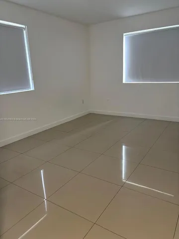 an empty room with a bench