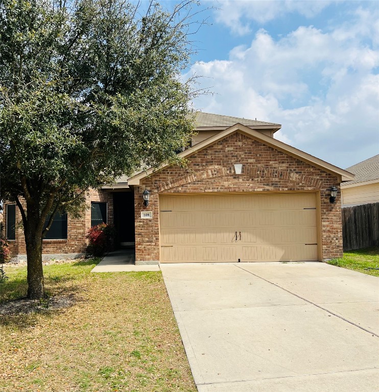 108 Major Lee Lane Jarrell, TX 76537 - Photo 1 of 15 a front view of a house with yard