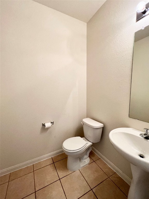 108 Major Lee Lane Jarrell, TX 76537 - Photo 15 of 15 a white toilet sitting next to a bathroom sink