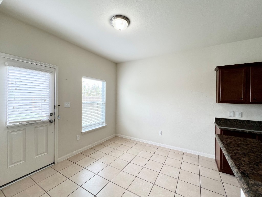 108 Major Lee Lane Jarrell, TX 76537 - Photo 8 of 15 a view of an empty room with window and cabinet