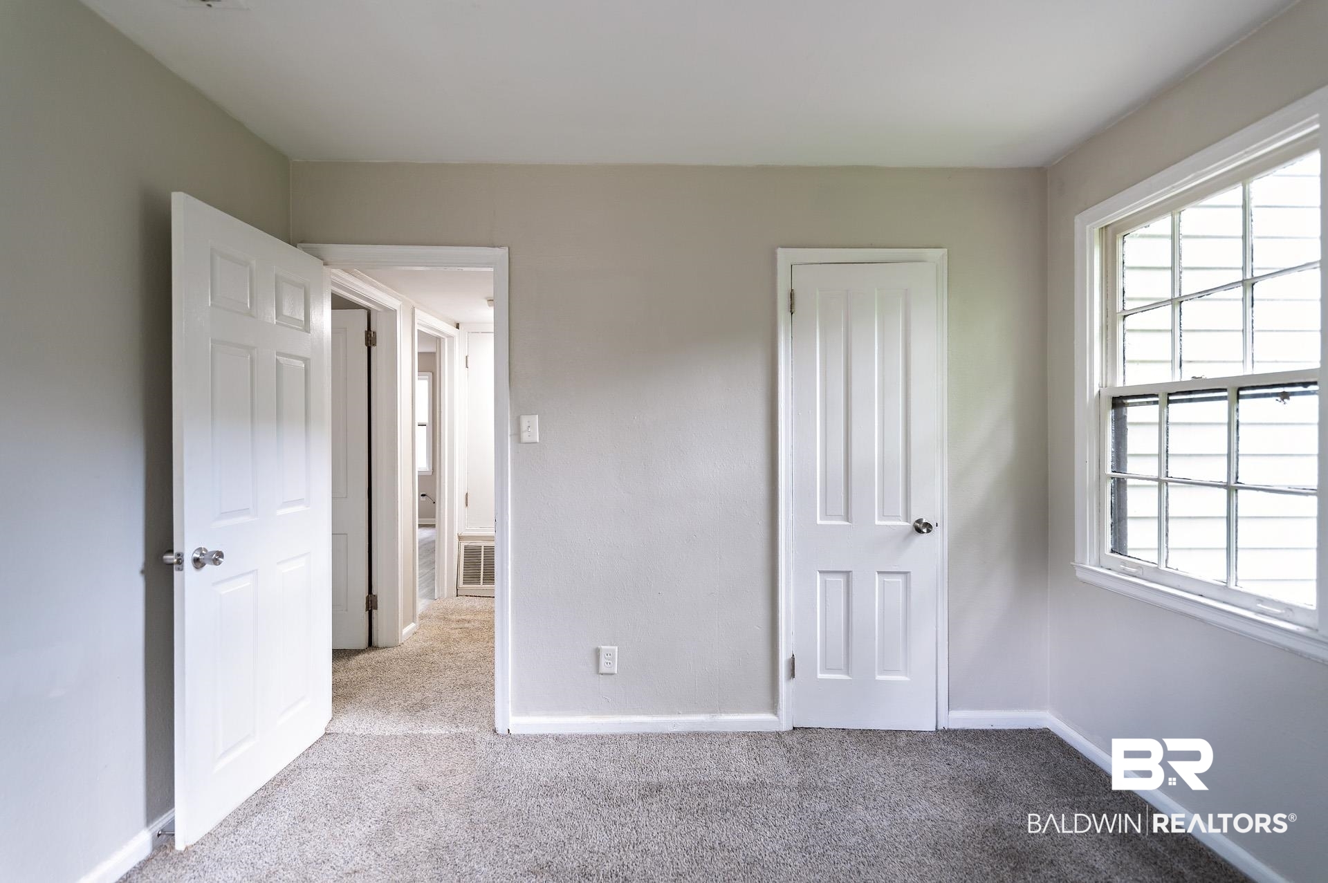 1869 Mott Drive West Mobile, AL 36617 - Photo 20 of 34 Unfurnished bedroom featuring carpet floors, baseboards, and visible vents
