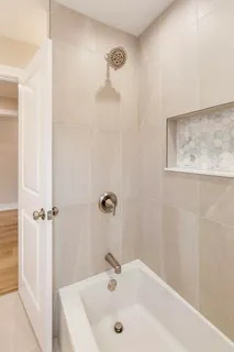 a bathroom with a sink and shower