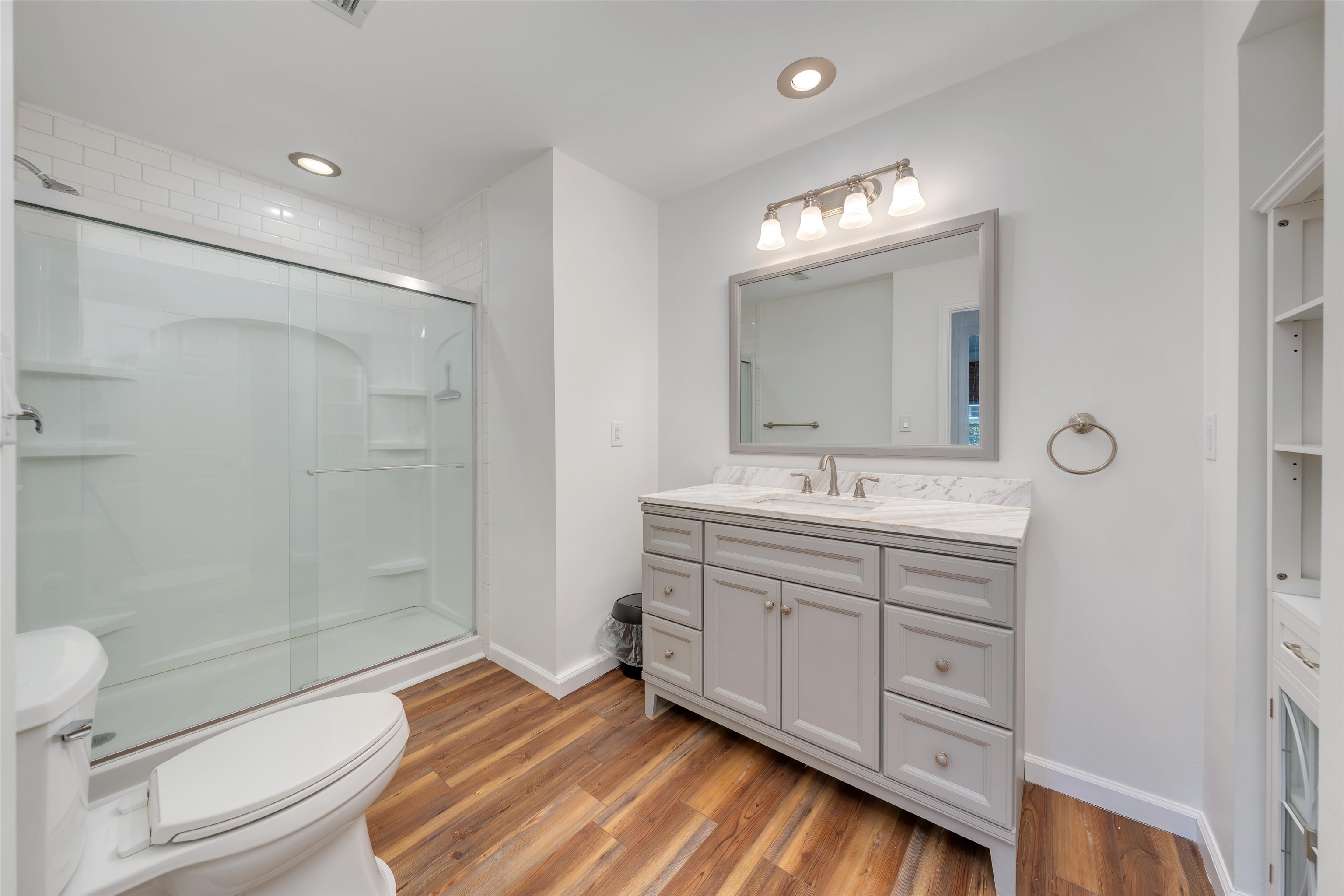 220 Iselin Road Cape May, NJ 08204 - Photo 26 of 43 a bathroom with a double vanity sink mirror and toilet