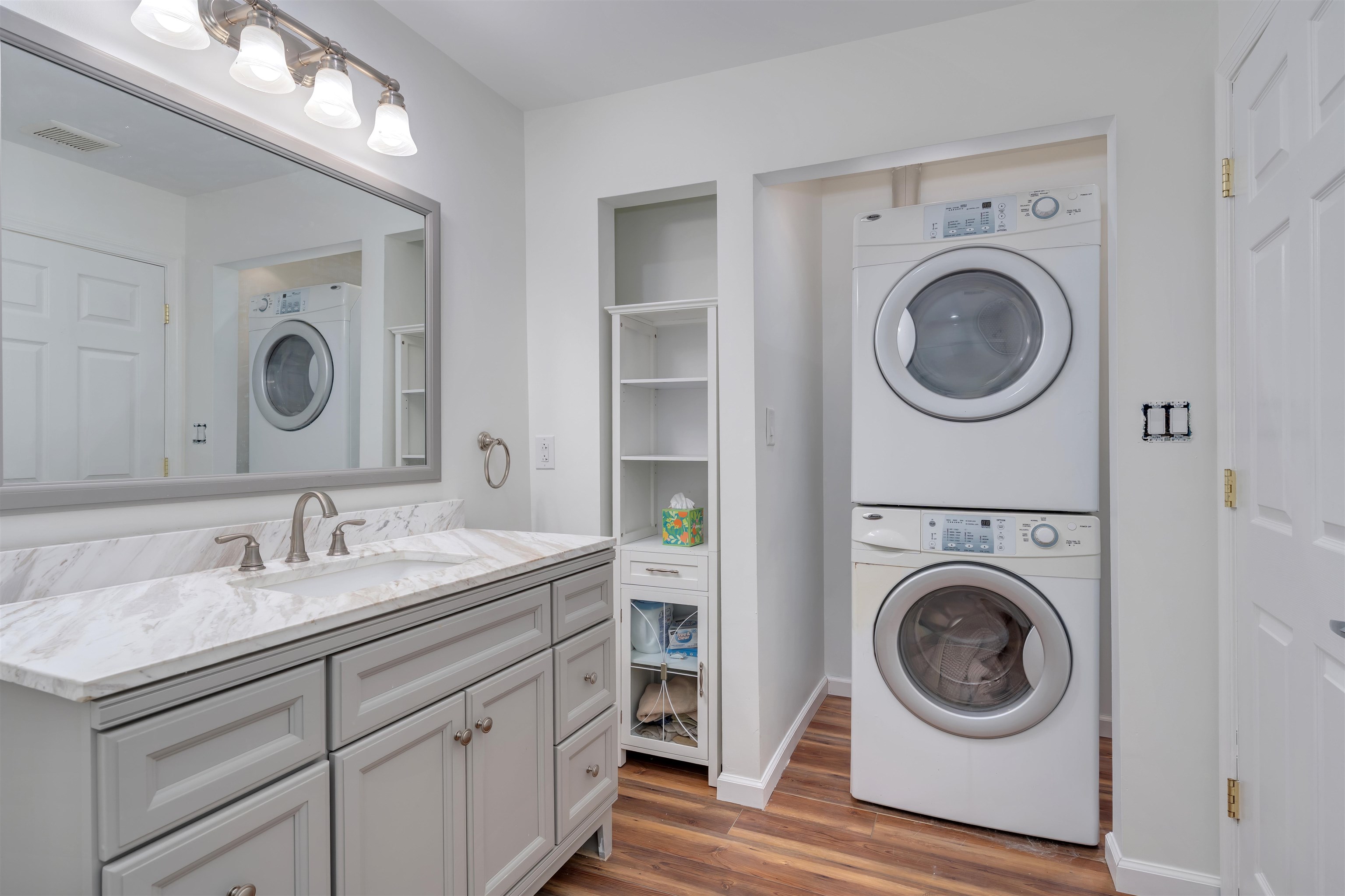 220 Iselin Road Cape May, NJ 08204 - Photo 27 of 43 a en suite bathroom with a granite countertop double vanity and a mirror