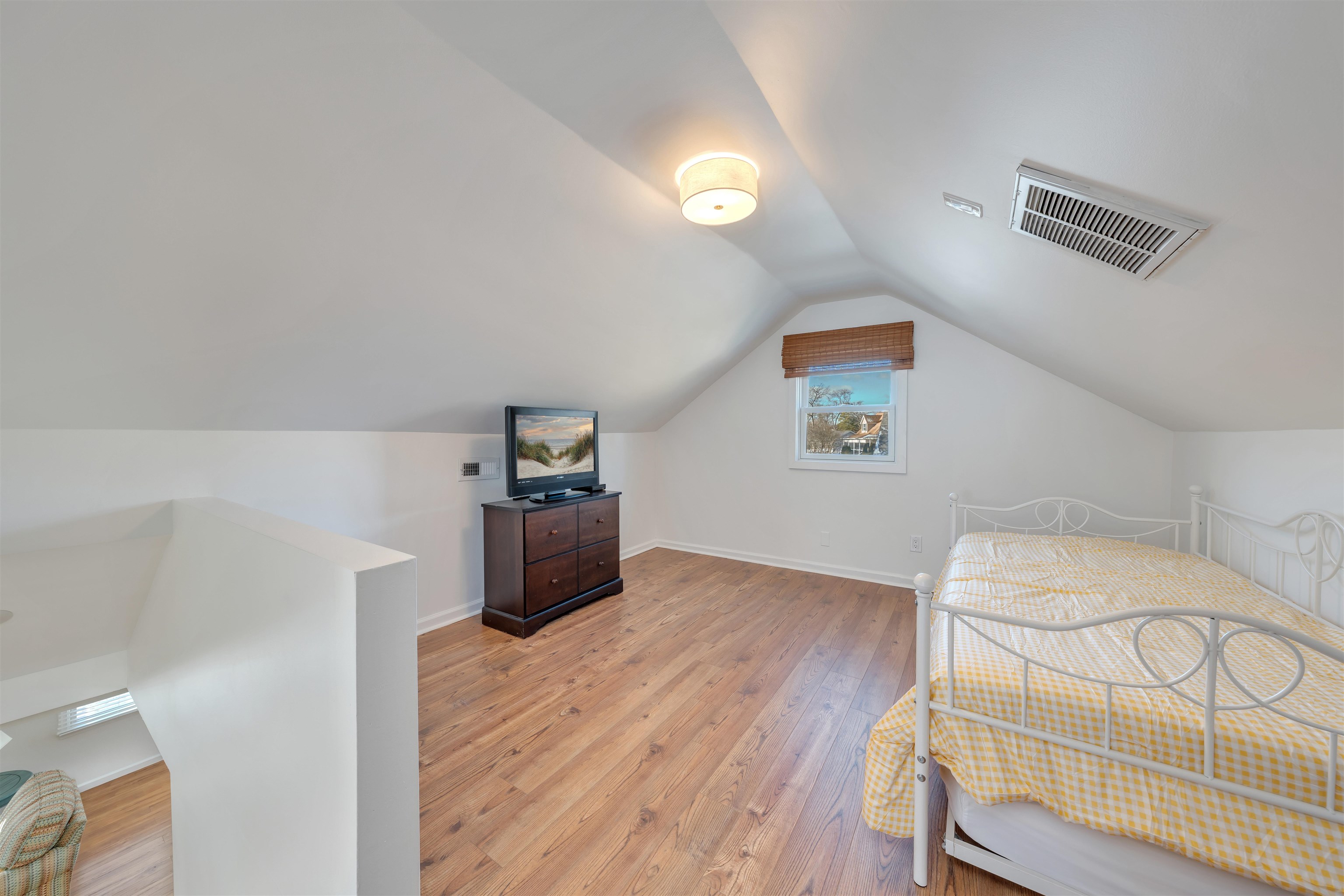 220 Iselin Road Cape May, NJ 08204 - Photo 28 of 43 a bedroom with a bed and a dresser