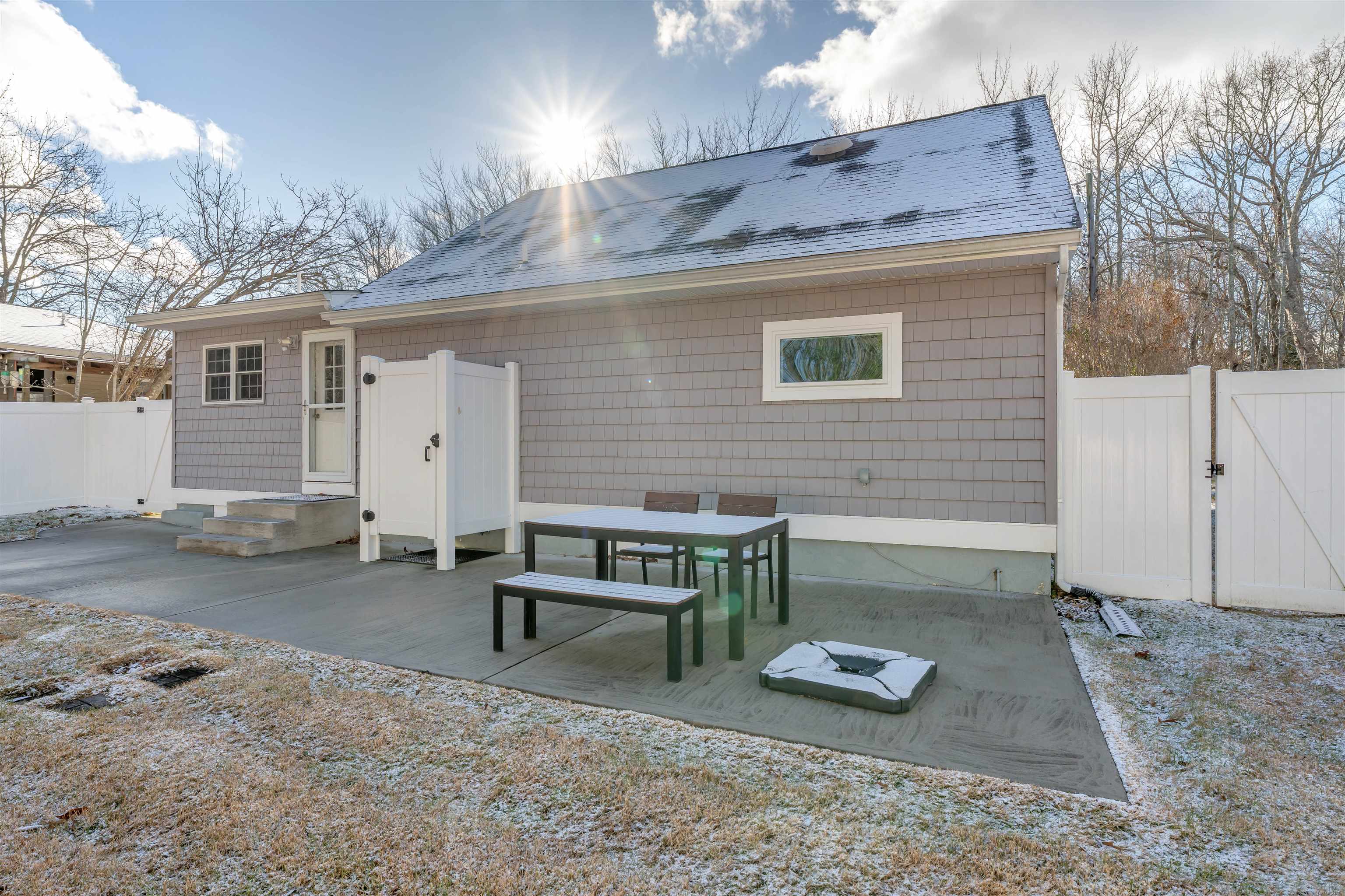 220 Iselin Road Cape May, NJ 08204 - Photo 35 of 43 a backyard of a house with barbeque oven table and chairs