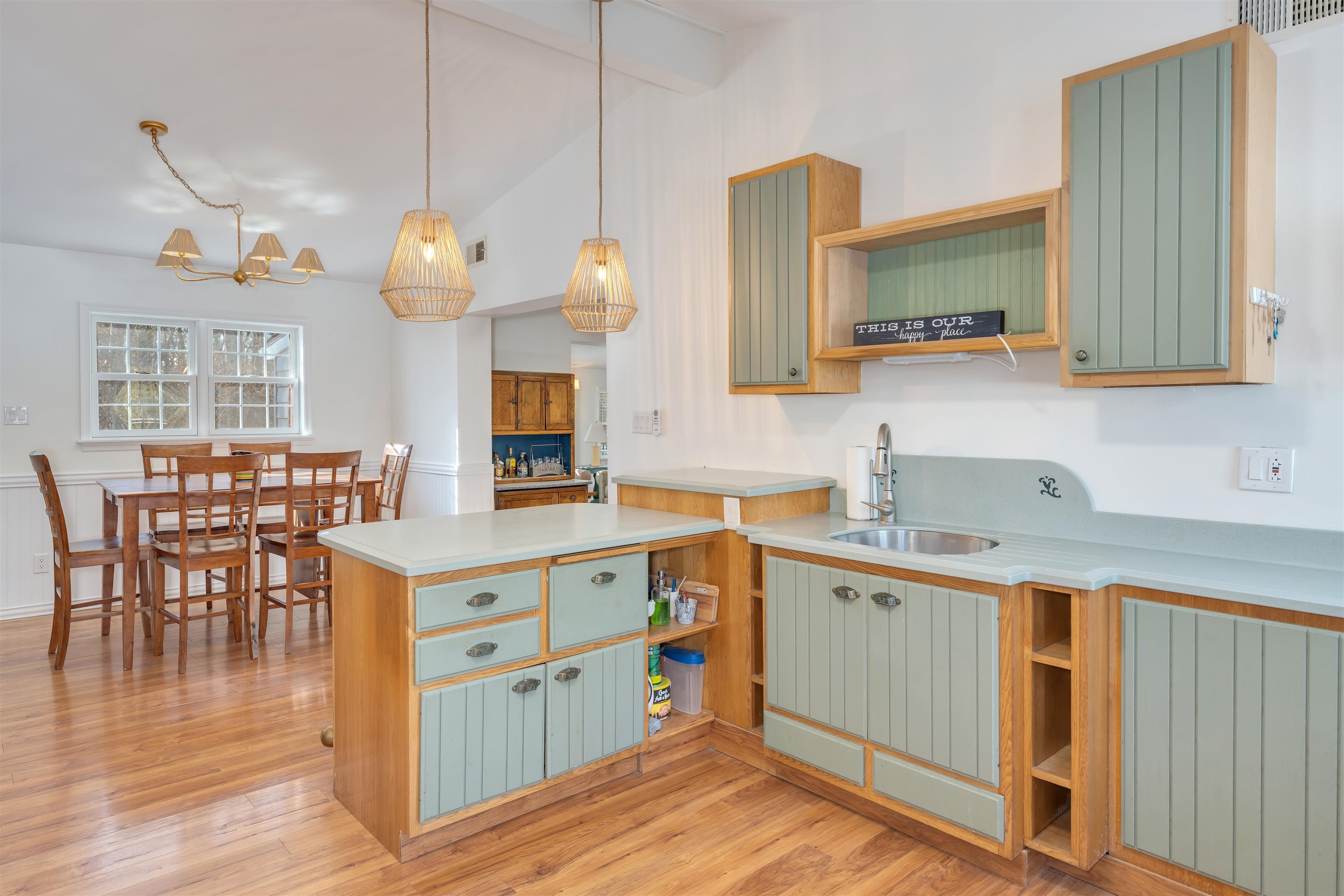 220 Iselin Road Cape May, NJ 08204 - Photo 9 of 43 a kitchen with a wooden floor and cabinets