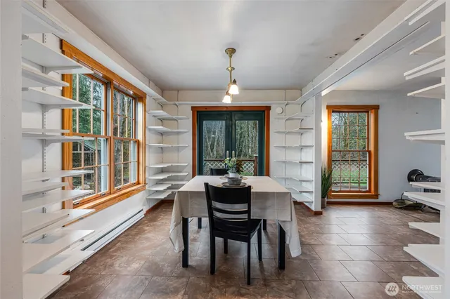 a view of a dining room with furniture window and outside view