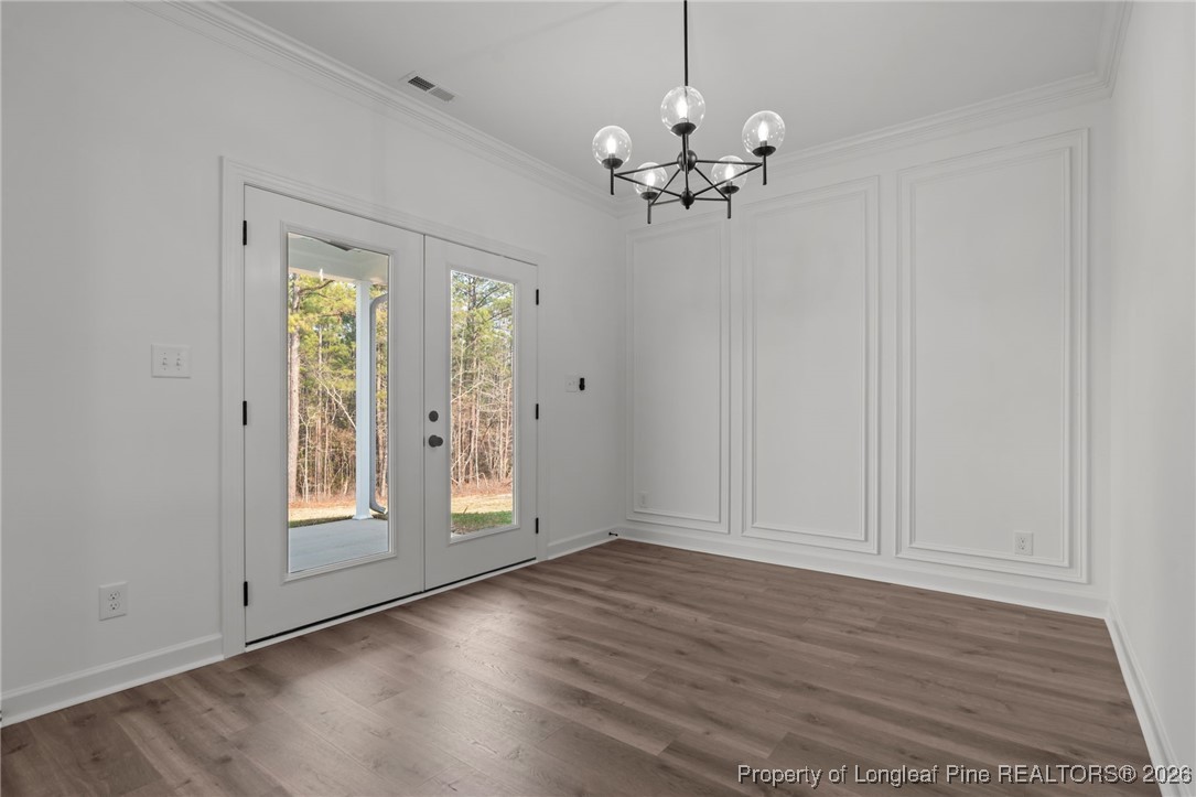 296 Persimmon Tree Drive Cameron, NC 28326 - Photo 12 of 43 a view of an empty room with wooden floor and a window