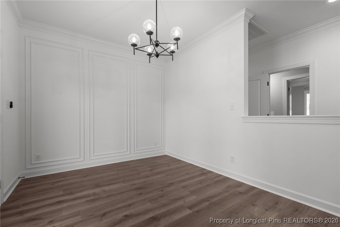 296 Persimmon Tree Drive Cameron, NC 28326 - Photo 13 of 43 a view of empty room with wooden floor and fan