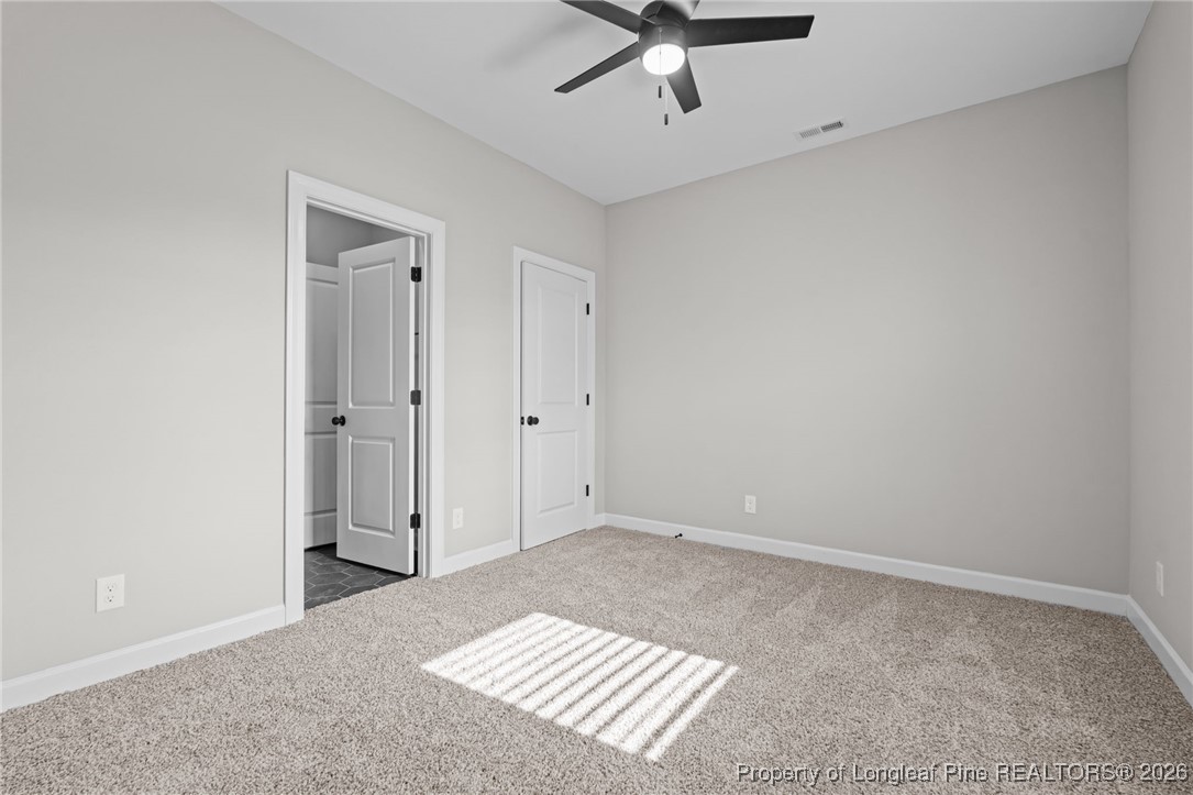 296 Persimmon Tree Drive Cameron, NC 28326 - Photo 16 of 43 a view of an empty room