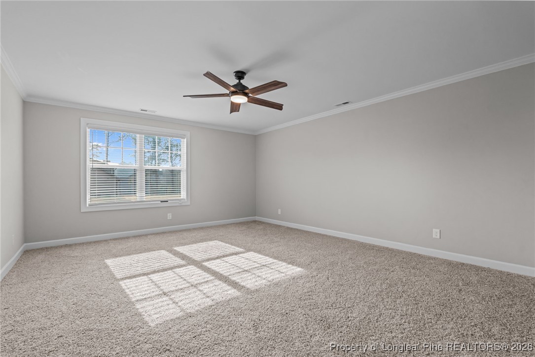 296 Persimmon Tree Drive Cameron, NC 28326 - Photo 18 of 43 an empty room with windows and ceiling fan