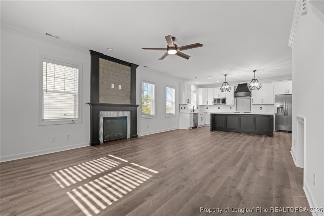 296 Persimmon Tree Drive Cameron, NC 28326 - Photo 2 of 43 a view of a kitchen with a sink and a stove top oven