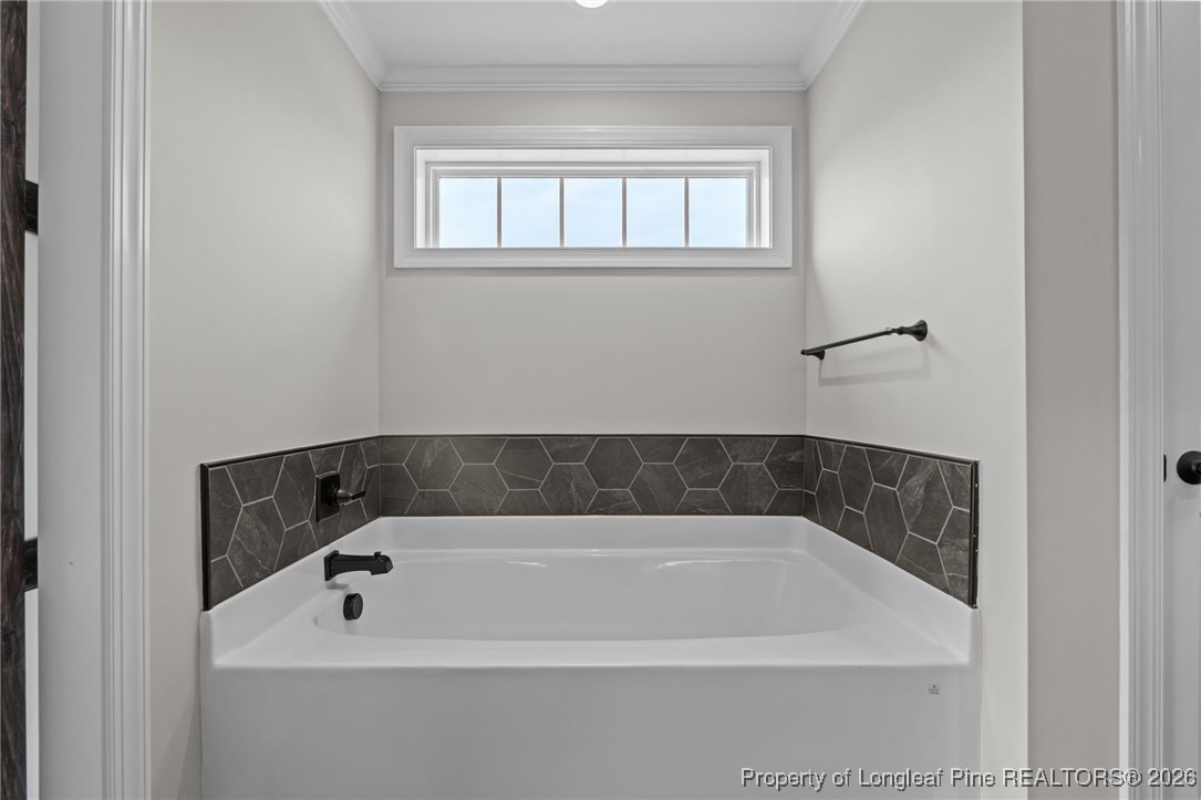 296 Persimmon Tree Drive Cameron, NC 28326 - Photo 23 of 43 a bathroom with a bath tub