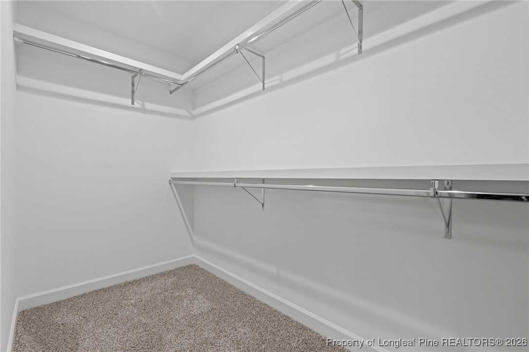 296 Persimmon Tree Drive Cameron, NC 28326 - Photo 24 of 43 a view of an empty walk in closet