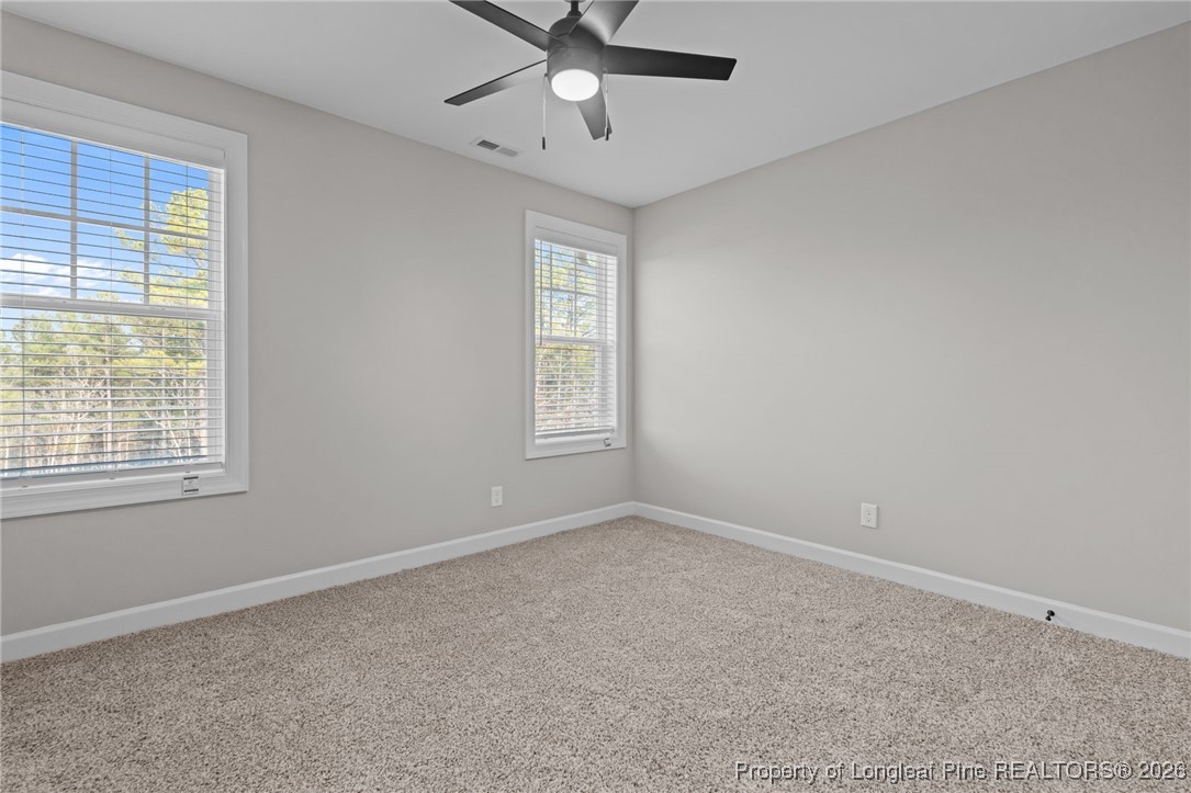 296 Persimmon Tree Drive Cameron, NC 28326 - Photo 26 of 43 a view of an empty room with a window