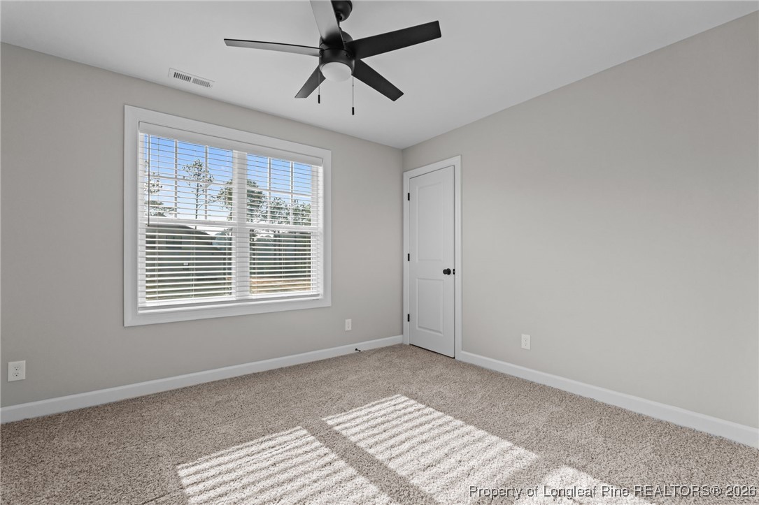 296 Persimmon Tree Drive Cameron, NC 28326 - Photo 28 of 43 a view of an empty room with a window