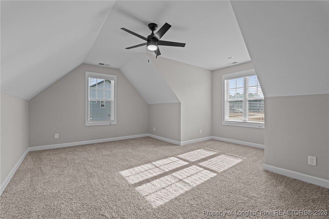 296 Persimmon Tree Drive Cameron, NC 28326 - Photo 29 of 43 an empty room with windows and ceiling fan