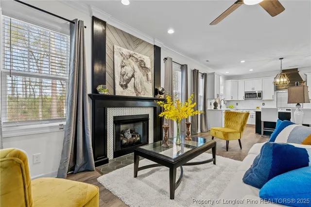 a living room with furniture and a fireplace