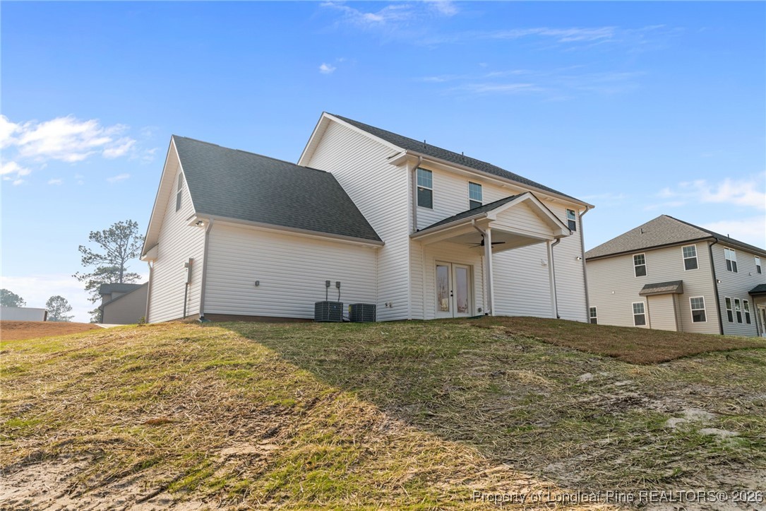 296 Persimmon Tree Drive Cameron, NC 28326 - Photo 31 of 43 a view of a house with a yard