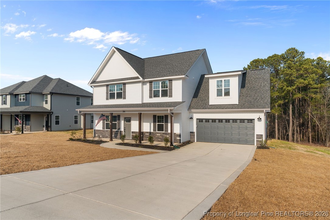 296 Persimmon Tree Drive Cameron, NC 28326 - Photo 36 of 43 a view of house with yard in front of it