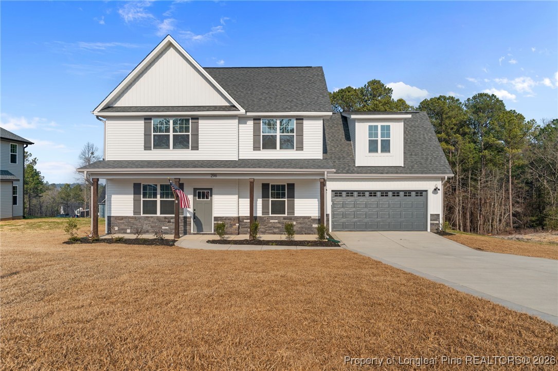 296 Persimmon Tree Drive Cameron, NC 28326 - Photo 37 of 43 a front view of a house with a yard