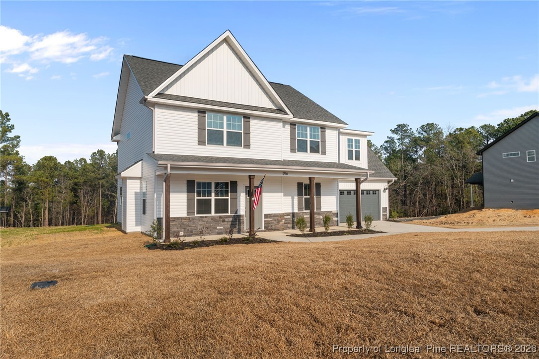 296 Persimmon Tree Drive Cameron, NC 28326 - Photo 38 of 43 a front view of a house with a yard