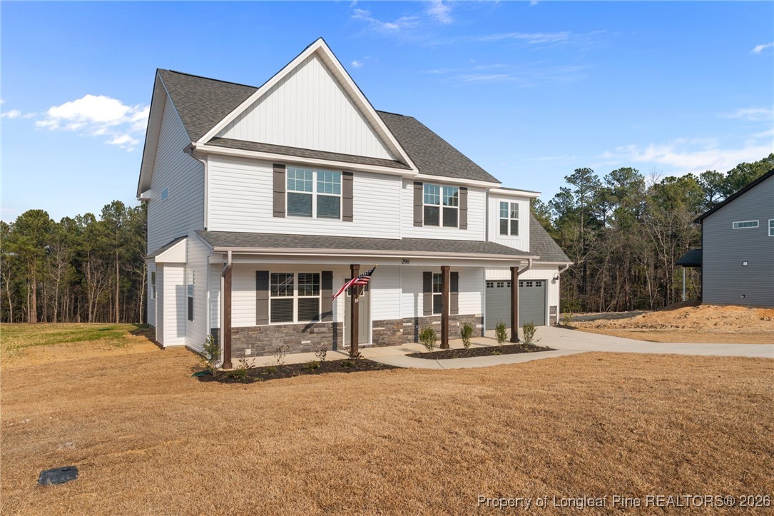 296 Persimmon Tree Drive Cameron, NC 28326 - Photo 39 of 43 a front view of a house with a yard