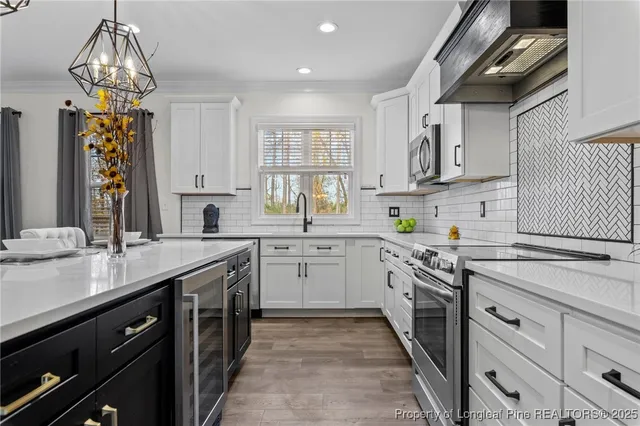 a kitchen with a sink and stove