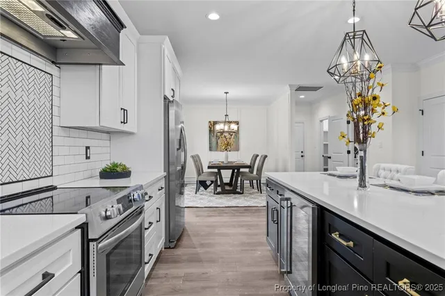 a kitchen with sink and cabinets