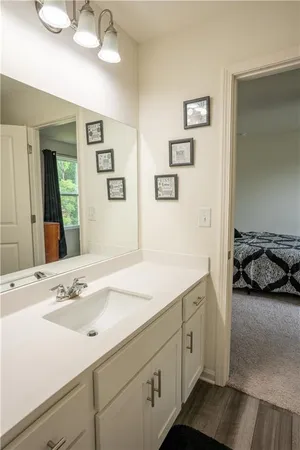 a en suite bathroom with a sink and a mirror