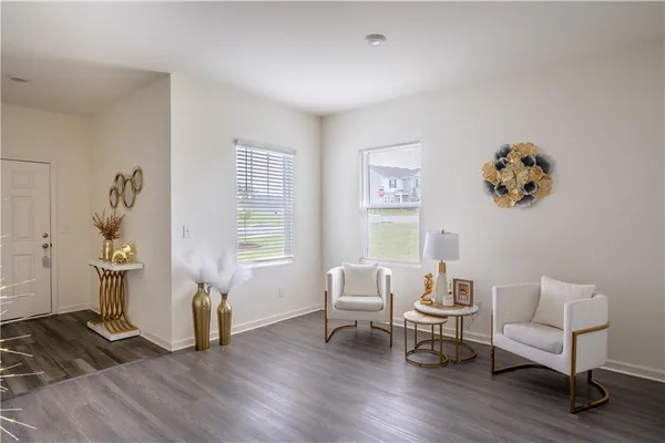 a living room with furniture and a table