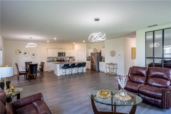 a living room with furniture and a table
