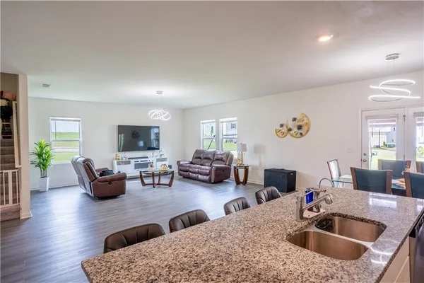 a kitchen counter top space with furniture and living room