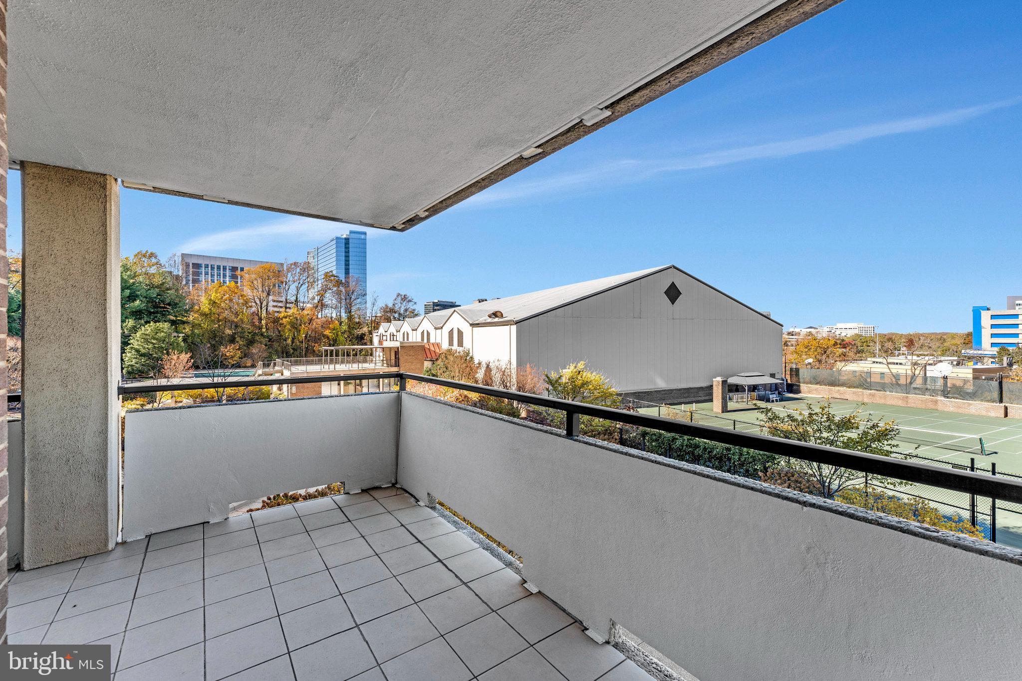 1800 Old Meadow Road, Unit 302 McLean, VA 22102 - Photo 21 of 35 a kitchen with stainless steel appliances a sink and a stove