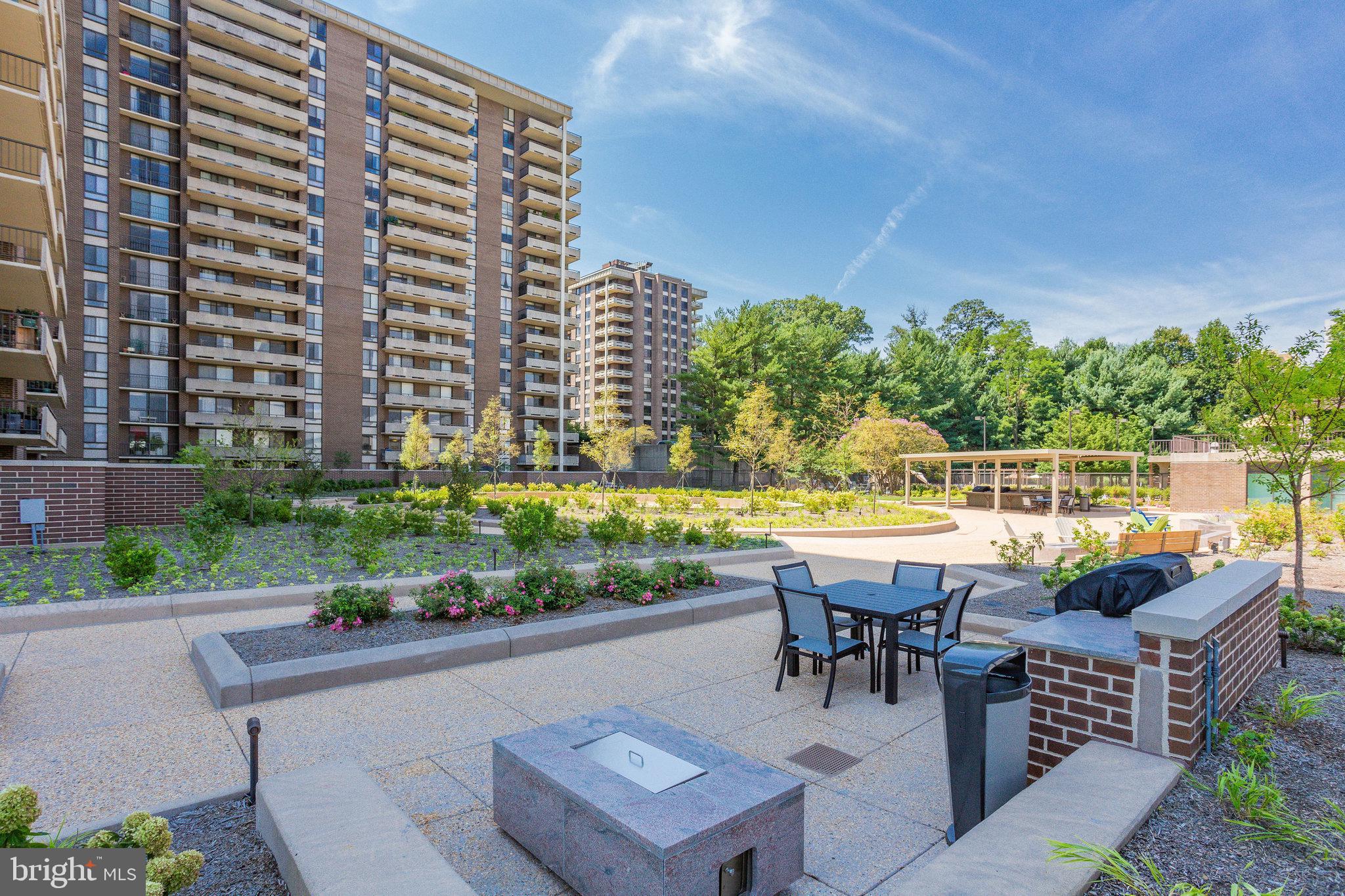 1800 Old Meadow Road, Unit 302 McLean, VA 22102 - Photo 29 of 35 a view of outdoor space with seating area and swimming pool