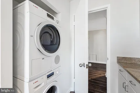 a view of a kitchen with washer and dryer