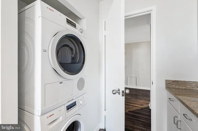a view of a kitchen with washer and dryer