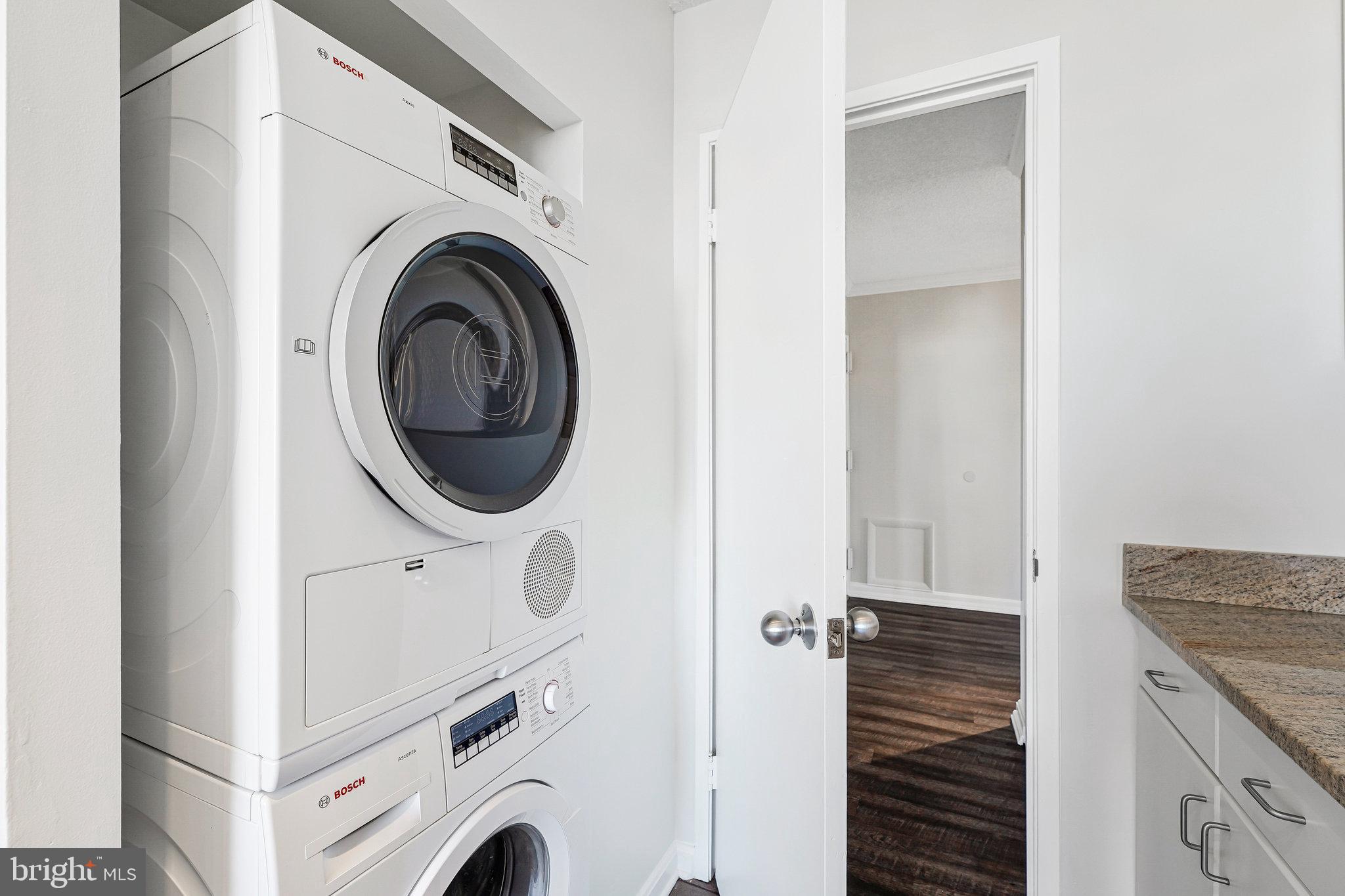 1800 Old Meadow Road, Unit 302 McLean, VA 22102 - Photo 9 of 35 a view of a kitchen with washer and dryer