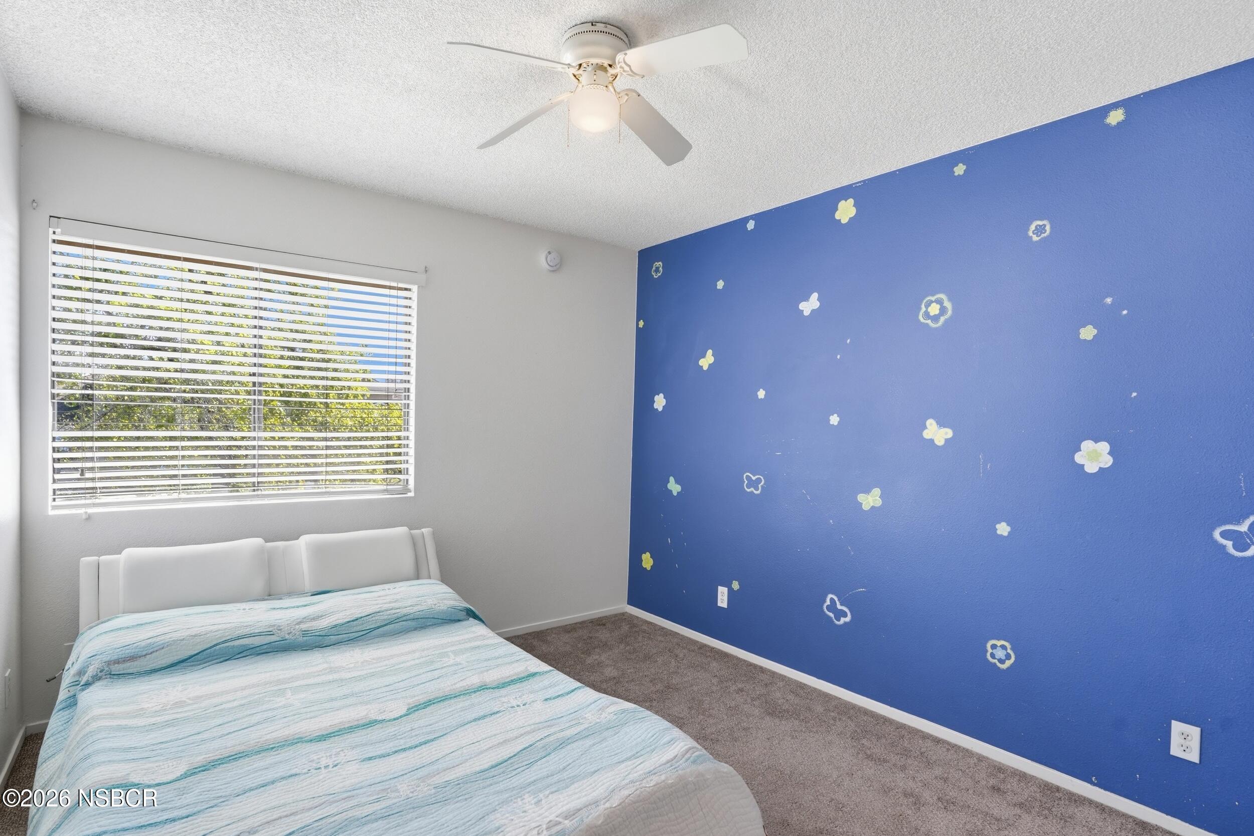 1193 East Foster Road, Unit D Santa Maria, CA 93455 - Photo 14 of 24 a bedroom with a bed and a window