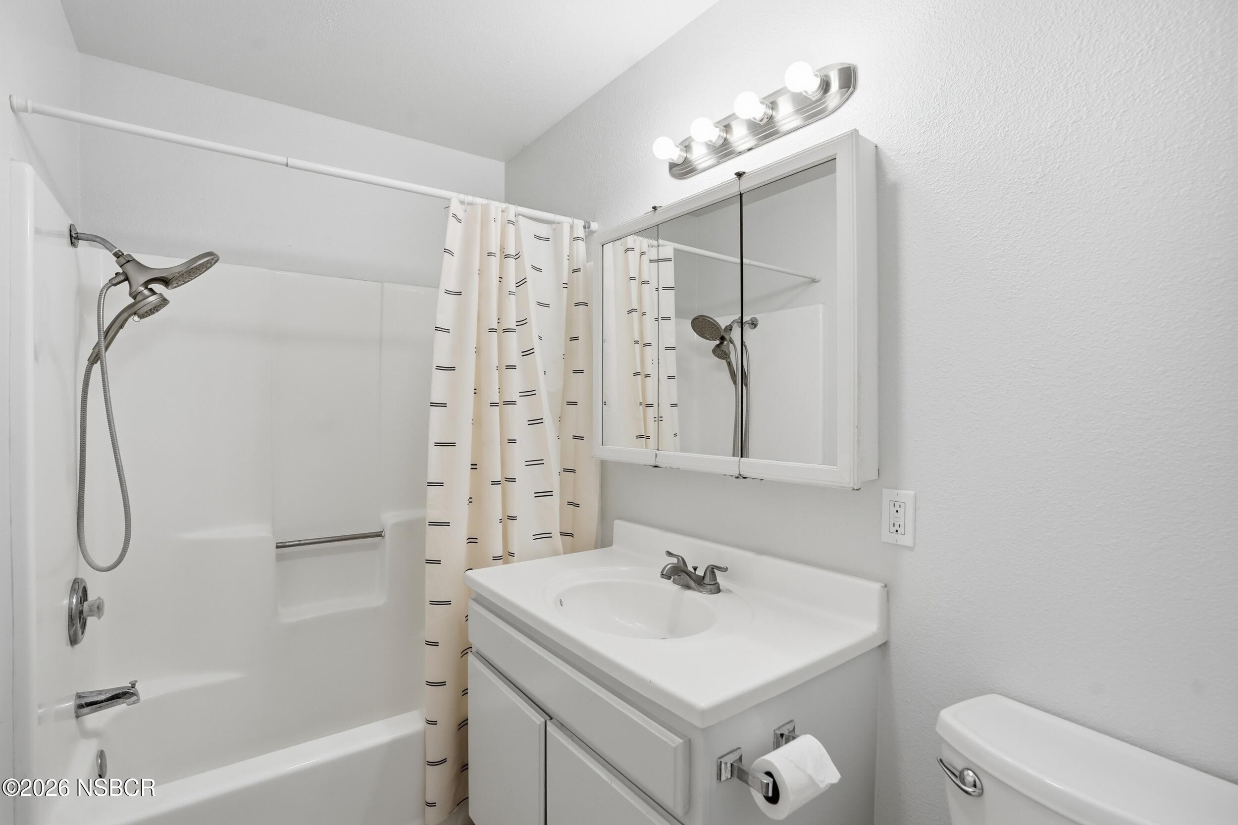 1193 East Foster Road, Unit D Santa Maria, CA 93455 - Photo 16 of 24 a bathroom with a sink a toilet and shower