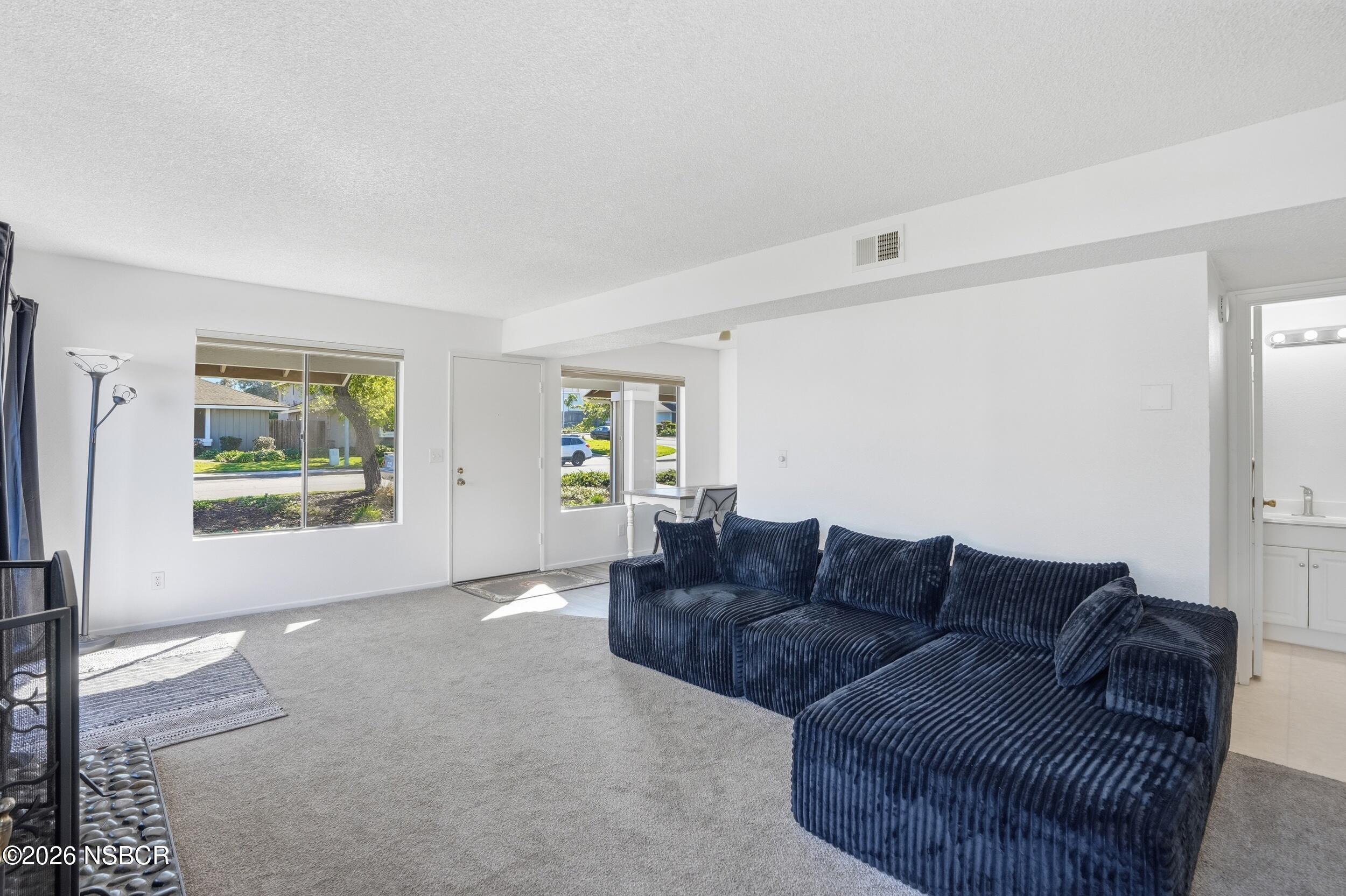 1193 East Foster Road, Unit D Santa Maria, CA 93455 - Photo 5 of 24 a living room with furniture and a window