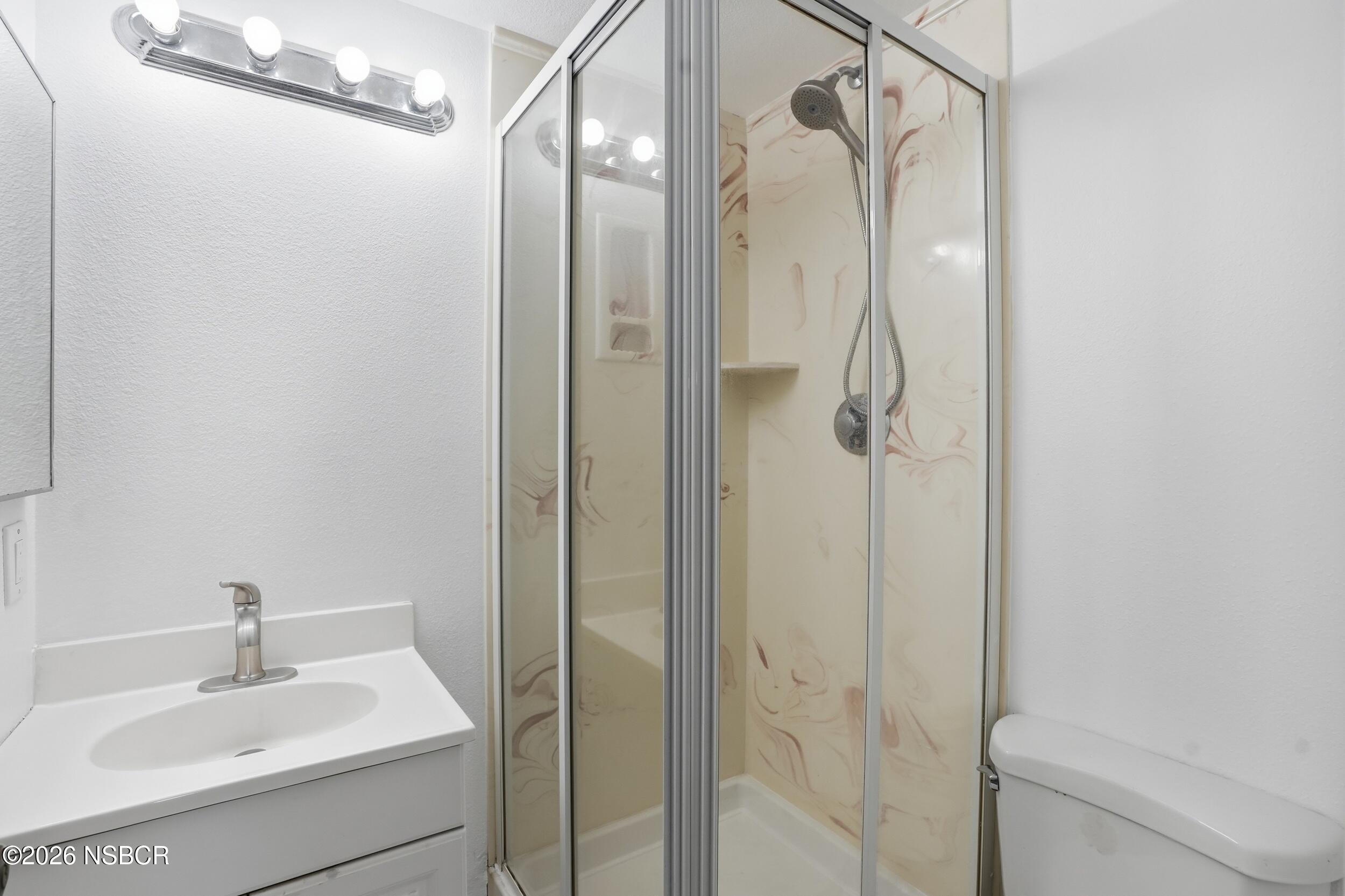 1193 East Foster Road, Unit D Santa Maria, CA 93455 - Photo 10 of 24 a bathroom with a shower and a sink