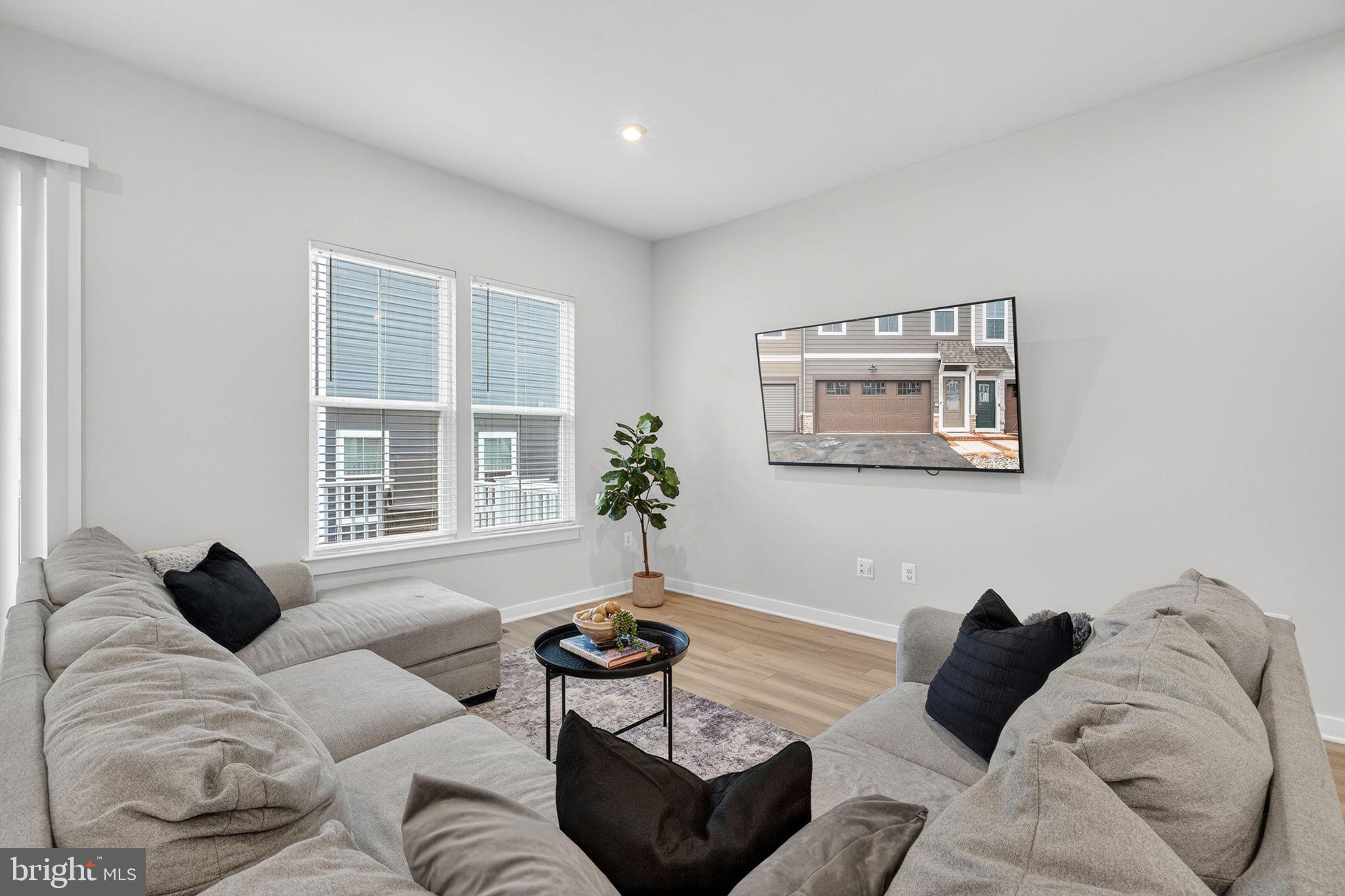 18245 Moss Garden Road Dumfries, VA 22026 - Photo 11 of 71 a living room with furniture and a window