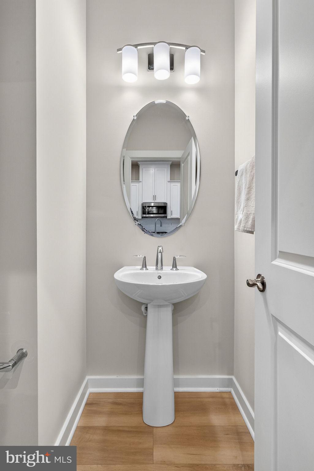 18245 Moss Garden Road Dumfries, VA 22026 - Photo 16 of 71 a bathroom with a sink and a mirror