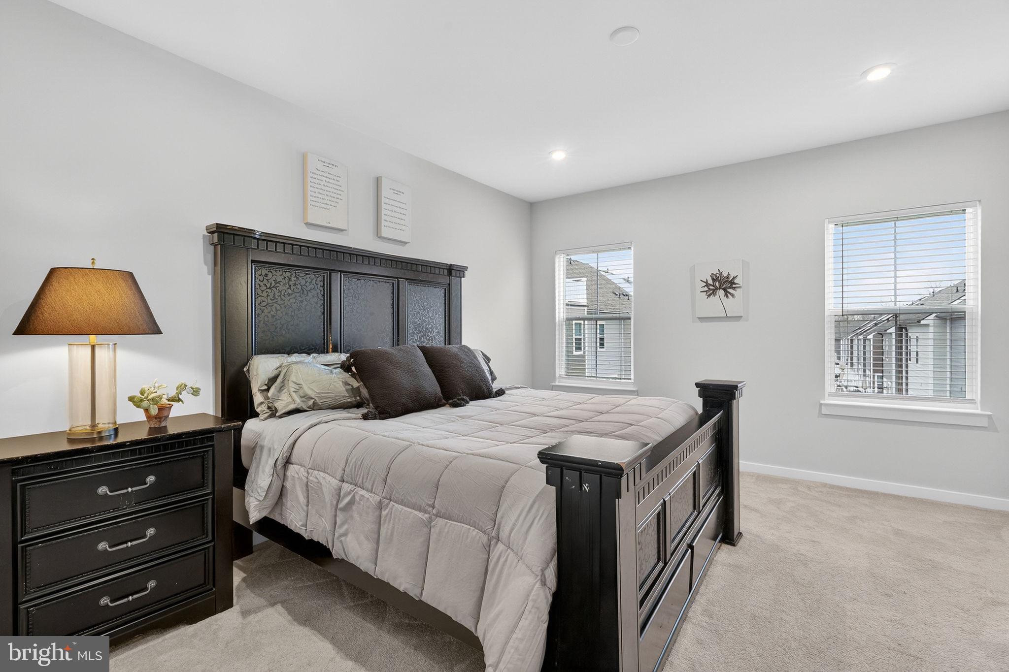 18245 Moss Garden Road Dumfries, VA 22026 - Photo 18 of 71 a bedroom with a bed and a window