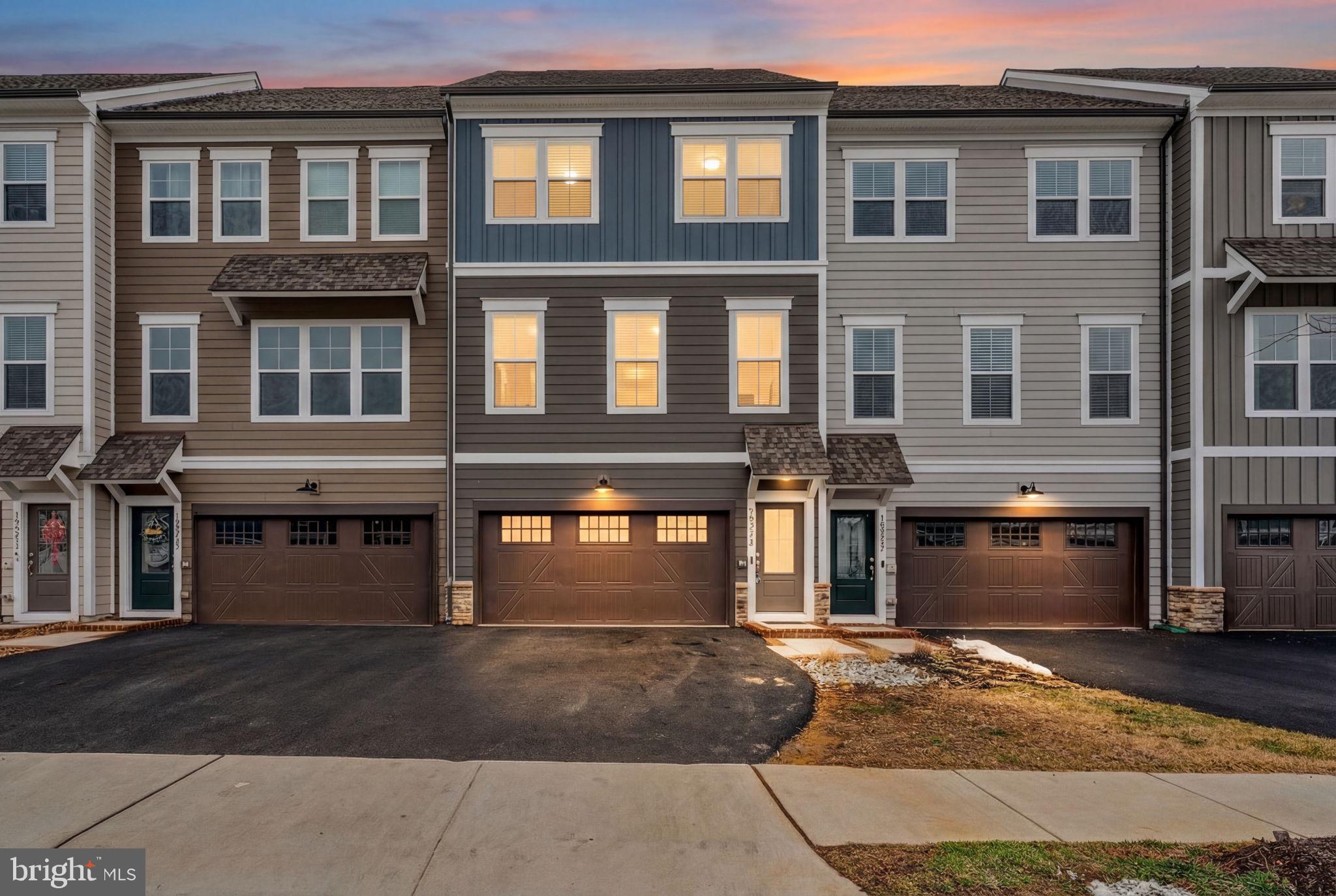 18245 Moss Garden Road Dumfries, VA 22026 - Photo 34 of 71 a front view of a house having yard