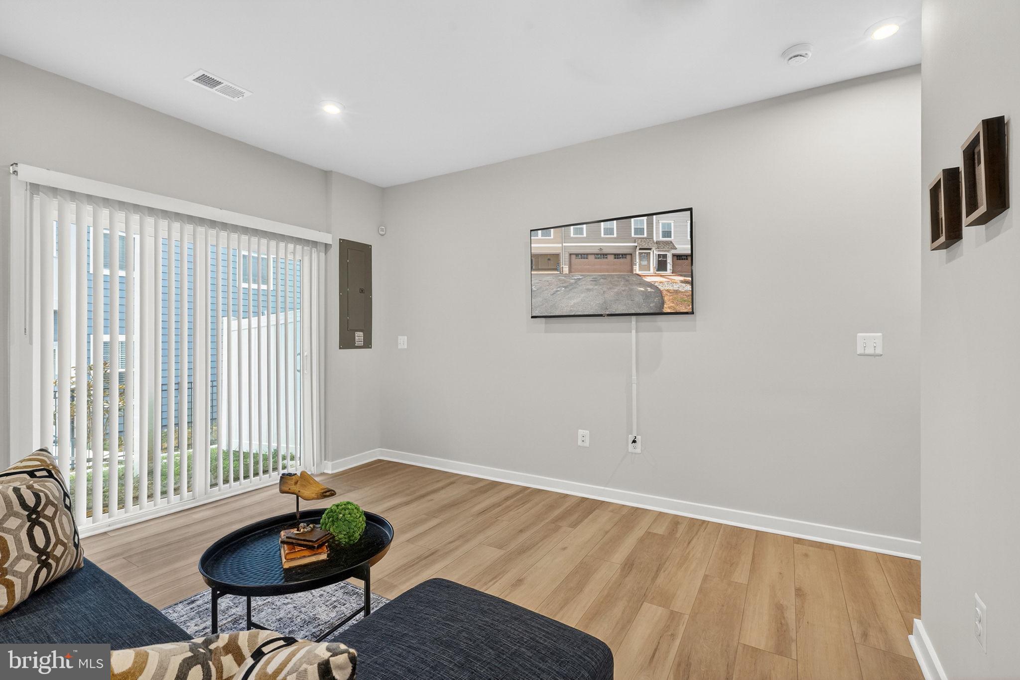 18245 Moss Garden Road Dumfries, VA 22026 - Photo 4 of 71 a living room with furniture and a window