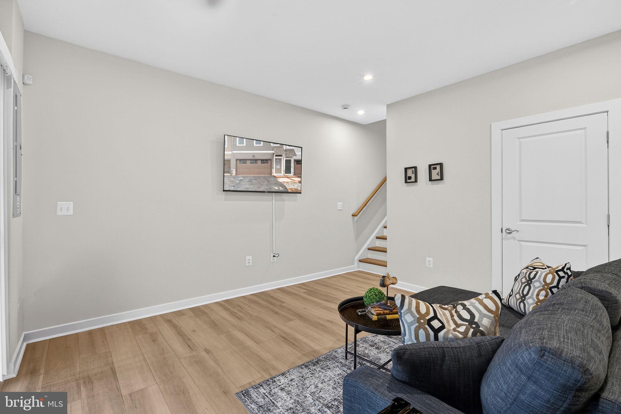 18245 Moss Garden Road Dumfries, VA 22026 - Photo 5 of 71 a living room with furniture and a wooden floor