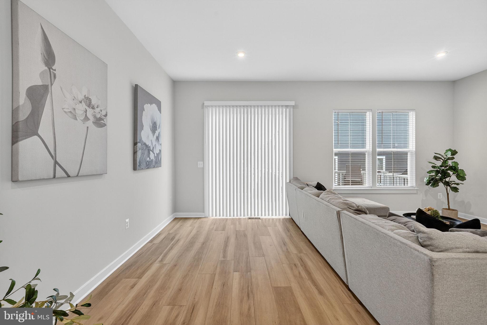 18245 Moss Garden Road Dumfries, VA 22026 - Photo 9 of 71 a view of a living room hardwood floor and a window